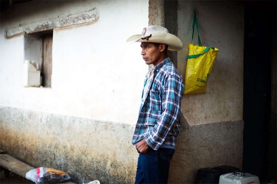 Emiliano waits at home for his day laborers to arrive to harvest his strawberries.