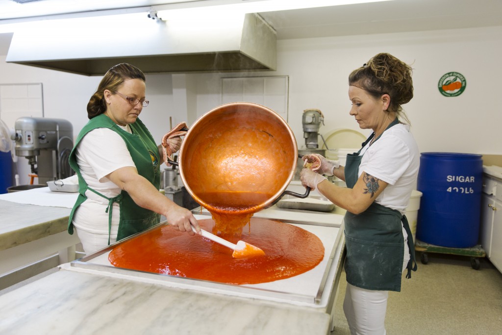 Workers prepare orange candies at Davidson of Dundee, a family business specialising in old-fashioned citrus candies, jellies, marmalades and chocolates, Dundee, Florida.