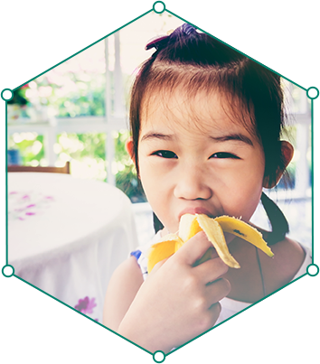 child eating a banana